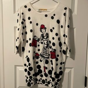 Light weight 3/4 sleeves fun sweater. Jewels on front of sweater not on the back